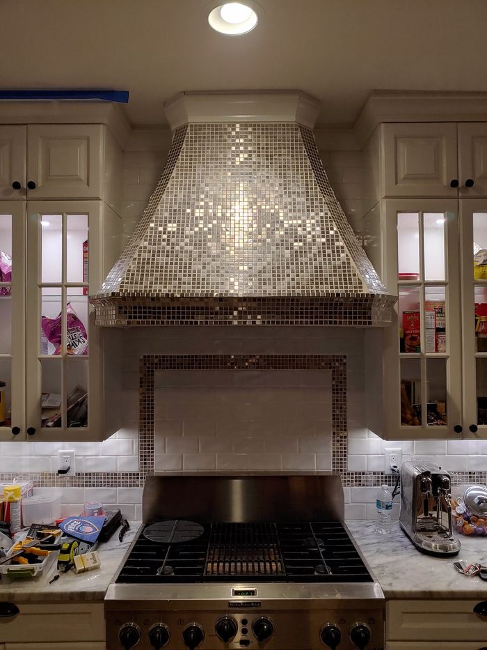 Mosaic tile range hood installed